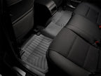 WeatherTech 11+ Ford F250/F350/F450/F550 Rear FloorLiner - Black installed in a truck interior