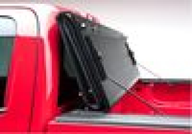 BAK 02-13 Chevy Avalanche/Escalade EXT BAKFlip F1 truck bed cover installed on red truck