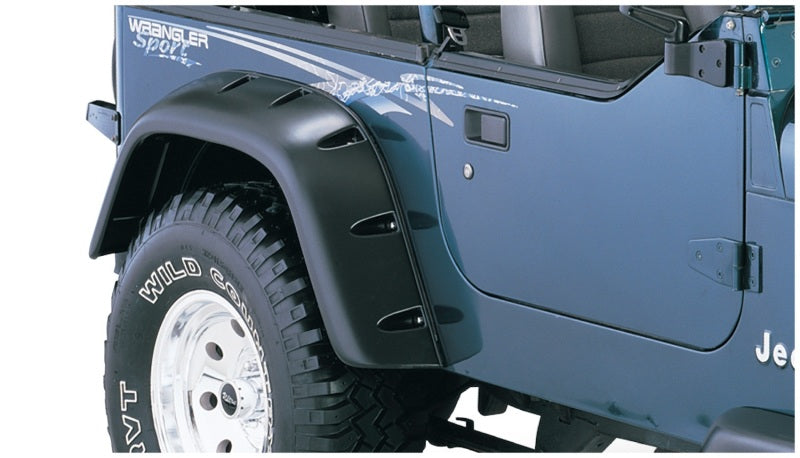 Bushwacker 87-95 Jeep Wrangler Cutout Style Flares 4pc Cutting Optional Not Renegade - Black on Jeep Wrangler with offroad wheels.