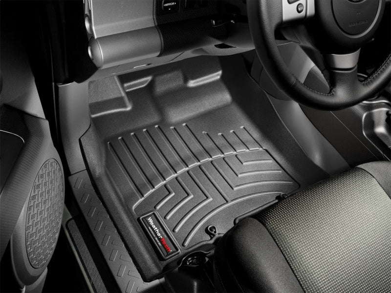 WeatherTech 07-10 Toyota FJ Cruiser Front FloorLiner - Black in vehicle interior