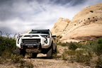 Body Armor 4x4 2014+ Toyota 4Runner HiLine Front Winch Bumper in off-road terrain