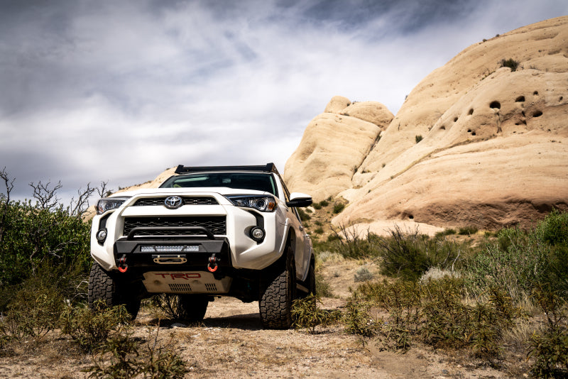 Body Armor 4x4 2014+ Toyota 4Runner HiLine Front Winch Bumper in off-road terrain