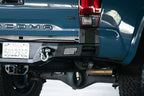 DV8 Offroad 16-23 Toyota Tacoma MTO Series Rear Bumper with clevis mounts and light pod.