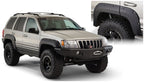 Bushwacker 99-04 Jeep Grand Cherokee Cutout Style Flares 2pc - Black on lifted vehicle with offroad tires and accessories.