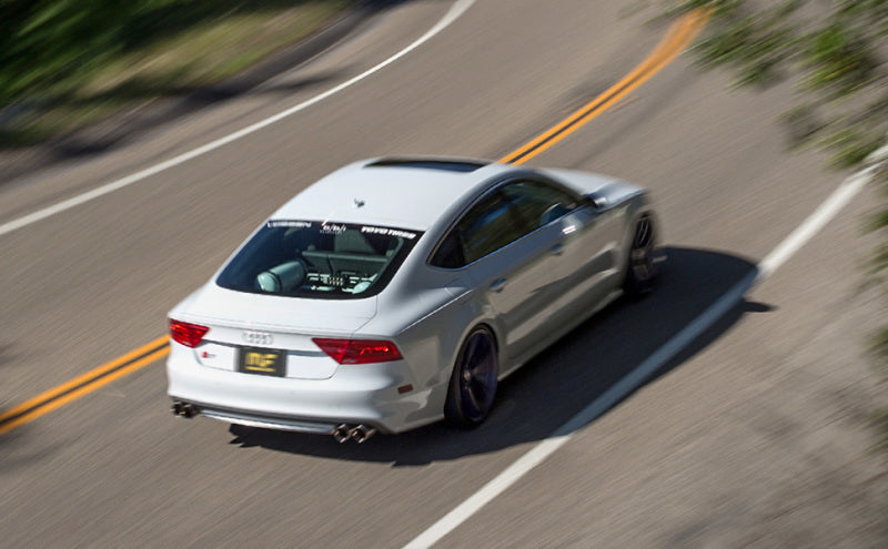 MagnaFlow SYS Cat-Back 2015 Audi A3 Quattro 2.0L T cruising on a winding road