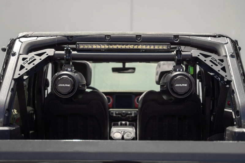 DV8 Offroad 18-23 Jeep Wrangler JL 4-Door Speaker/Light Bar Mount with audio speakers and light bar installed.
