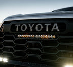 Baja Designs 2022 Toyota Tundra TRD 20in S8 OEM Replacement Kit - Amber installed on truck grille