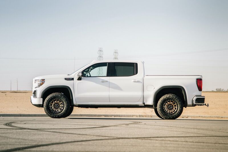 Cognito 19-24 Chevy Silv/Sierra 1500 2/4WD 3in Perf Ball Joint Lvl Lift Kit w/Fox PS Coilovr 2.0 IFP on white truck