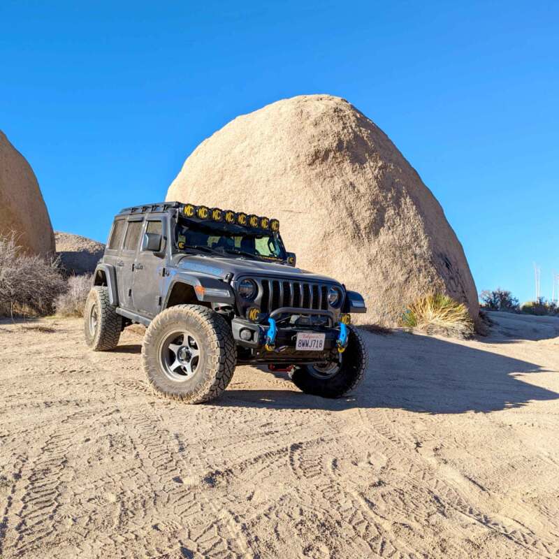 KC HiLiTES 2021+ Jeep Wrangler 4XE 50in Overhead Light Bar Mounting Bracket Set on an off-road adventure