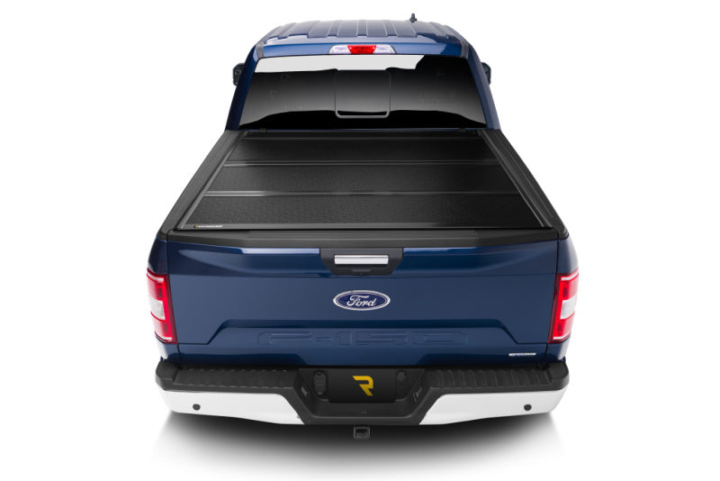 BAK 21-22 Ford F-150 (Incl. 2022 Lightning) BAKFlip FiberMax 5.7ft Bed Cover installed on blue truck