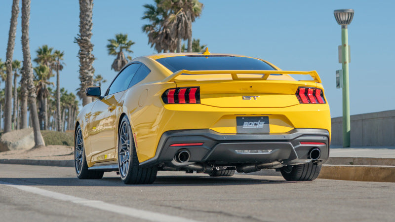 Borla 2024 Ford Mustang GT 5.0L V8 w/o Active Exhaust ATAK Cat-Back Exhaust System - Black Chrome on a yellow Mustang.