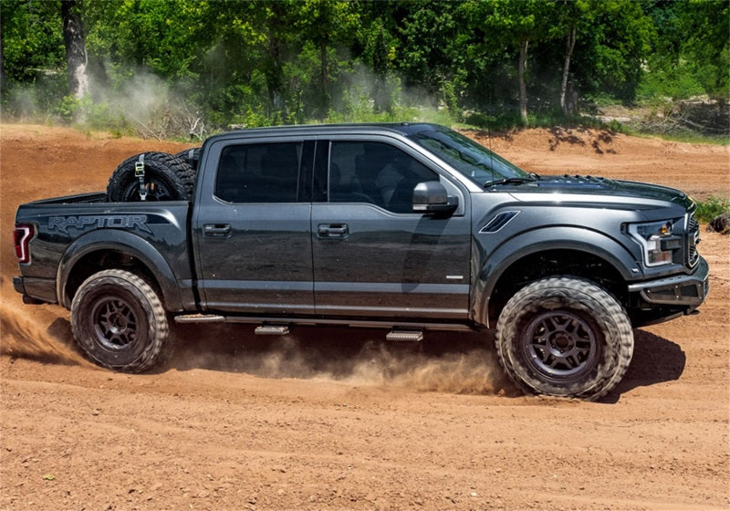 N-Fab RKR Rails 16-17 Toyota Tacoma Double Cab - Tex. Black - 1.75in. on off road terrain with performance offroad parts
