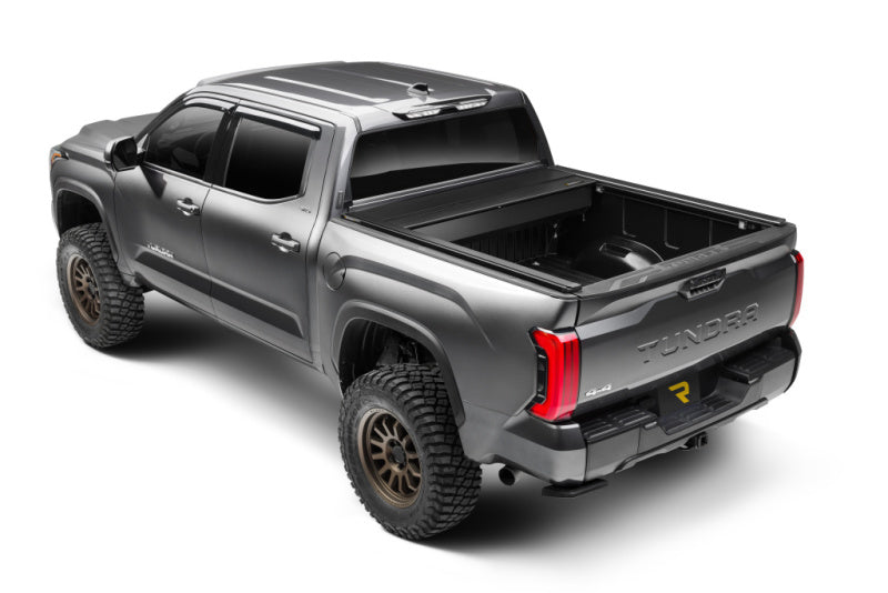 Retrax 2024 Ford F-150 SuperCrew/Super Cab 5.5ft. Bed Retrax EQ with offroad tires and exterior accessories for trucks.