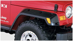 Bushwacker 97-06 Jeep TJ Pocket Style Flares 4pc - Black on Jeep Wrangler with offroad tires