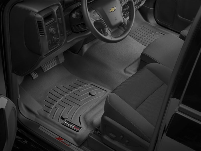 WeatherTech 14+ Chevrolet Silverado Front FloorLiner - Black in truck interior for ultimate protection.