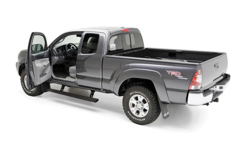 AMP Research 2016-2017 Toyota Tacoma Double Cab/Access PowerStep - Black in use on grey truck