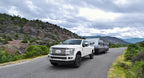 Air Lift Loadlifter 5000 Rear Air Spring Kit for 17-22 Ford F250/F350 SRW 4WD w/ Block Lift towing a trailer.