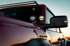 Rigid Industries 360-Series 4in LED Off-Road Spot Beam - RGBW (Pair) mounted on truck mirror for offroad performance upgrades.