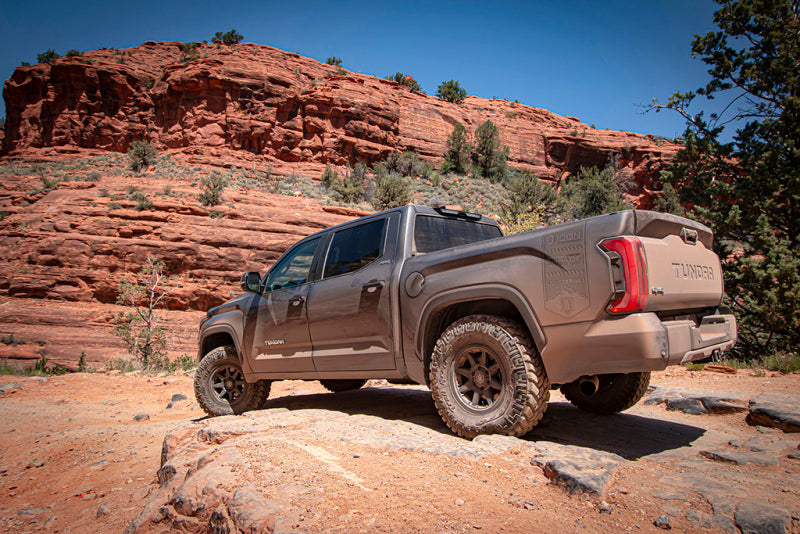 ICON 22+ Toyota Tundra 0-1in Rear 2.0 Aluminum Series Shock VS IR on off-road terrain