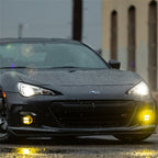 Rigid Industries 360-Series 4in LED SAE J583 Fog Light - Selective Yellow (Pair) on a black Subaru with rain