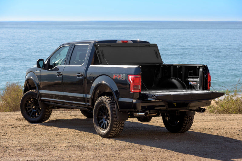 BAK 2024 Ford Ranger BAKFlip MX4 5ft Bed - Hard Folding truck bed cover with offroad wheels.