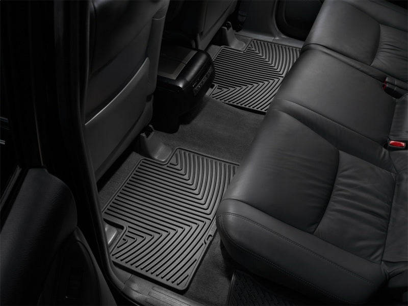 WeatherTech 05-13 Toyota Tacoma Crew Cab Rear Rubber Mats - Black installed in vehicle for optimal protection