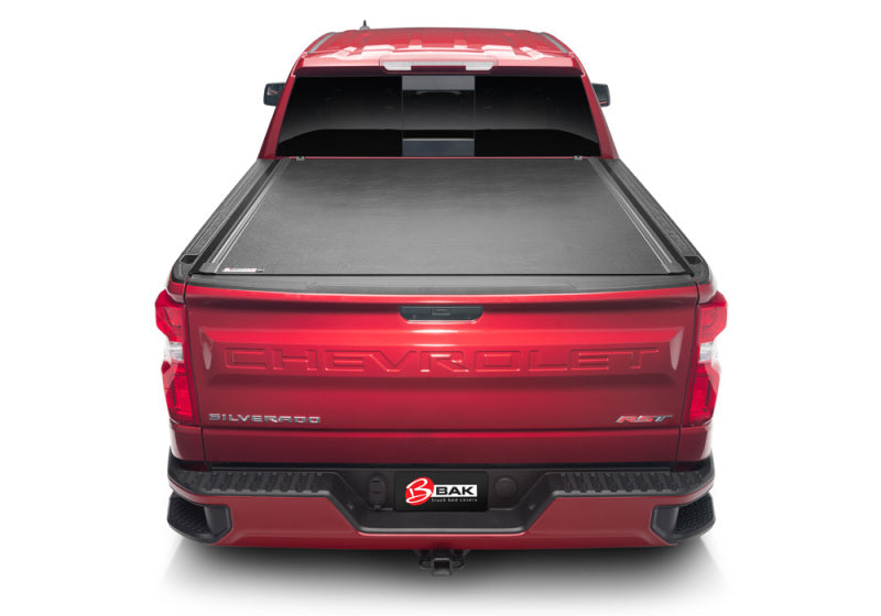 BAK 19-20 Chevy Silverado 5ft 8in Bed (New Body Style) Revolver X2 hard rolling cover on red truck