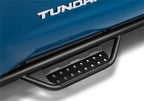 N-Fab RS Nerf Step 05-15 Toyota Tacoma (Gas) Double Cab 5ft Short Bed - Cab Length - Tex. Black close-up view for offroad truck accessories.