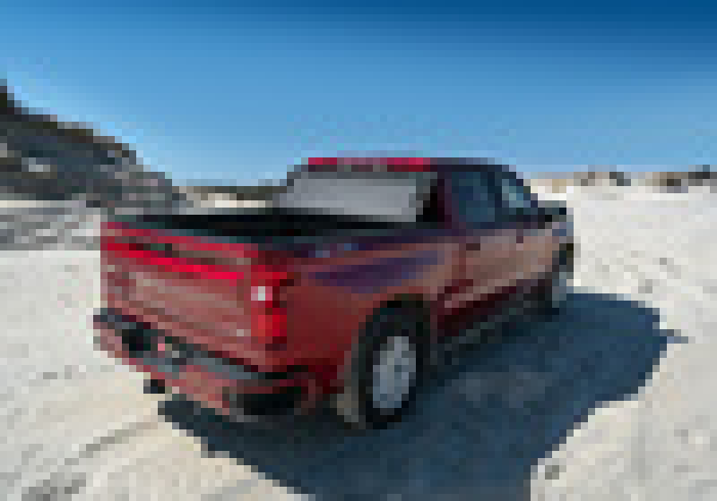 BAK 2020 Chevy Silverado 2500/3500 HD 8ft Bed BAKFlip MX4 Matte Finish on red truck in off road environment.