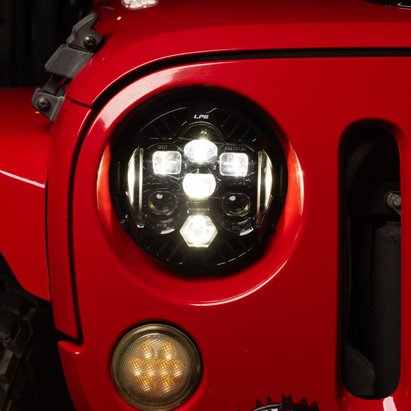 Baja Designs 07-18 Jeep Wrangler JK DOT LP6 LED Headlight Kit (For LED Headlights) - Clear/White installed on Jeep