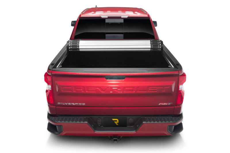 BAK 19-20 Chevy Silverado 5ft 8in Bed (New Body Style) Revolver X2 hard roll-up cover installed on a red truck bed.