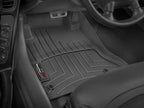 WeatherTech 97-2004 Chevy Corvette Front FloorLiner - Black installed in vehicle interior.