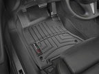 WeatherTech 14+ Infiniti Q50 Front FloorLiner - Black on vehicle floor, protecting carpet from dirt and moisture.