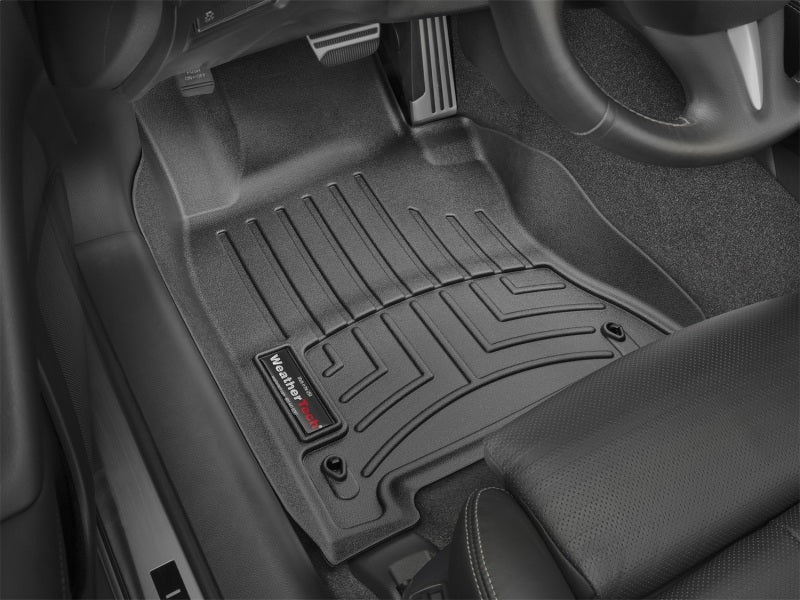 WeatherTech 14+ Infiniti Q50 Front FloorLiner - Black on vehicle floor, protecting carpet from dirt and moisture.