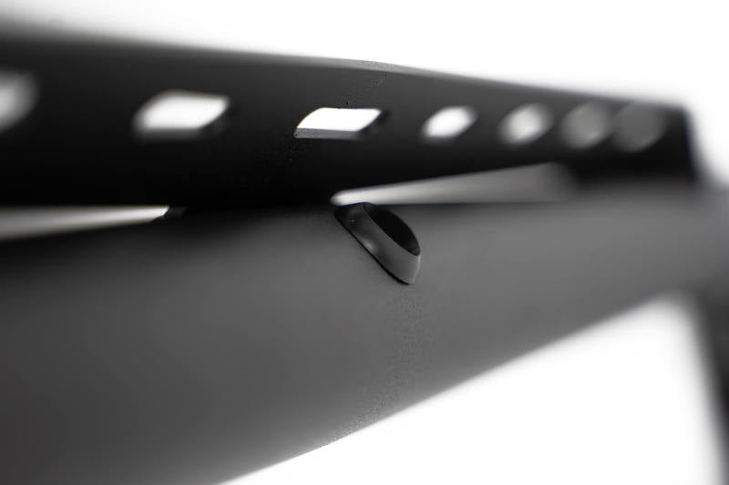 Close-up of DV8 Offroad 18-23 Jeep Wrangler JL 4-Door Speaker/Light Bar Mount featuring mounting holes.