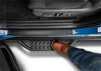 N-Fab RS Nerf Step 19-21 Dodge Ram 2500/3500 - Crew Cab - Tex. Black step with boot resting on it, ideal for truck accessories.