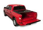 BAK 2024 Toyota Tacoma 5ft Bed BAKFlip Fibermax Bed Cover installed on a red truck.
