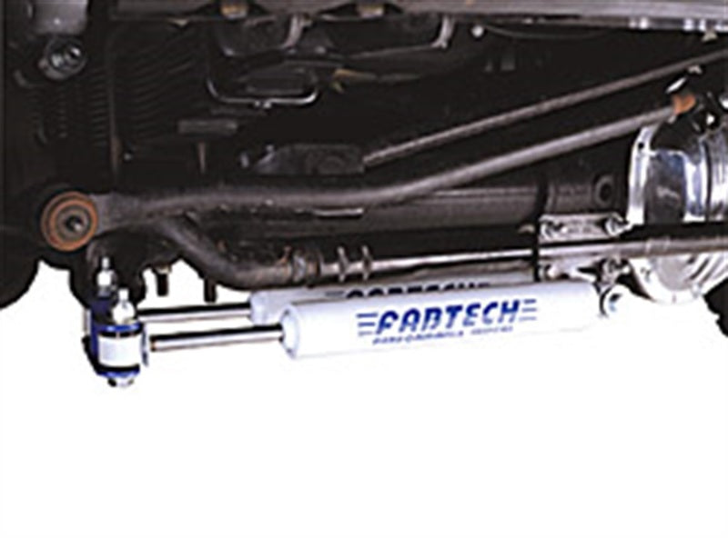 Fabtech 99-03 Ford F250/350/Excursion 2WD Dual Performance Steering Stabilizer Kit mounted under vehicle