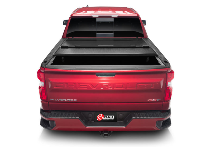 BAK 19-20 Chevy Silverado 6ft 6in Bed 1500 (New Body Style) BAKFlip G2 truck bed cover installed on red truck.