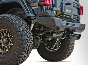 Off-road Jeep with performance exhaust and rugged tires.